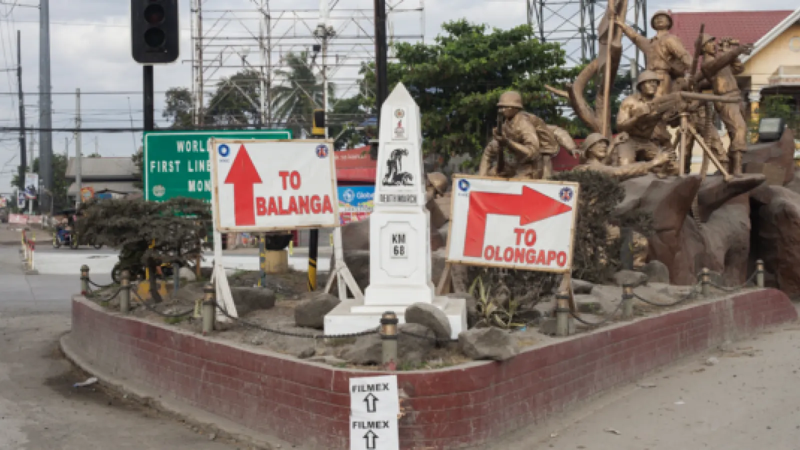 Street roundabout covered in signs.