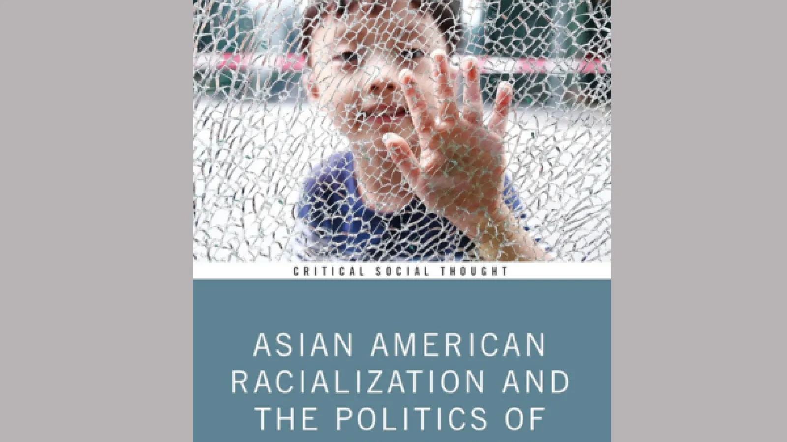 Child behind a shattered glass window
