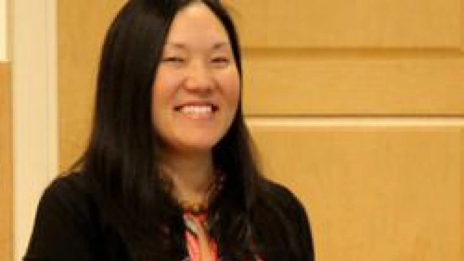 Lynn Itagaki accepting an award